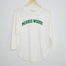 Load image into Gallery viewer, A white, 3/4 sleeve t-shirt that says "Merrie-Woode" across chest in green lettering hanging on a wooden hanger.