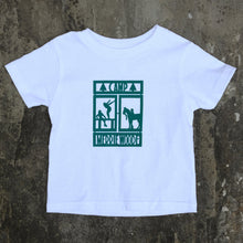 Load image into Gallery viewer, White, baby tshirt that has the Merrie-Woode rectangle logo on the front, which shows a horse, its rider, and two girls on a dock. 
