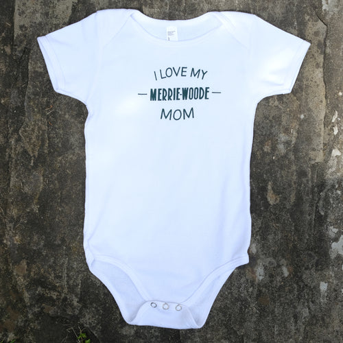 White baby onesie that says 