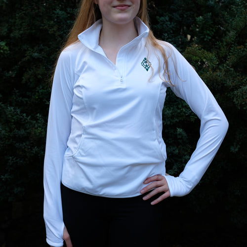 Young, blonde girl wearing white, quarter zip athletic pull over with the Merrie-Woode diamond logo by the top right shoulder. 